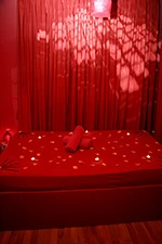 The red room of the Mon Amour erotic massage parlour in Bucharest at the opening in 2008.